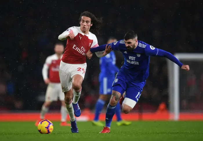 Framed Print : Intense Battle: Guendouzi vs. Paterson in Arsenal's Premier League Clash against Cardiff