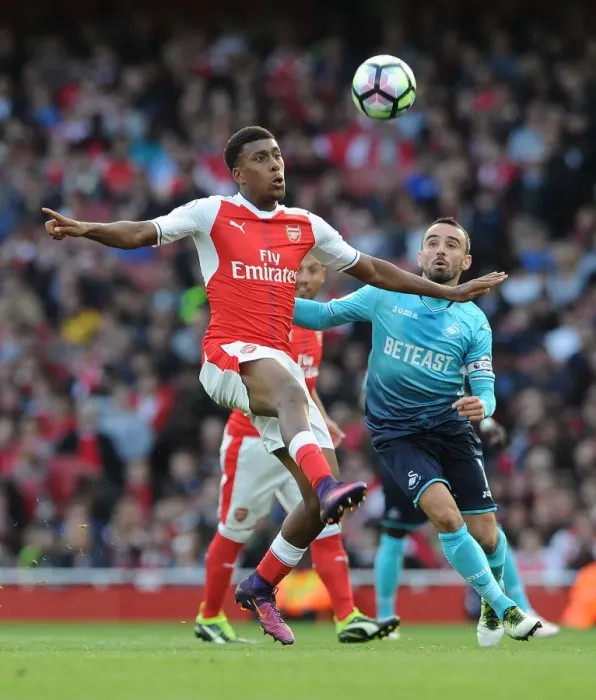 Framed Print : Intense Battle: Iwobi vs Britton in Arsenal vs Swansea Premier League Clash