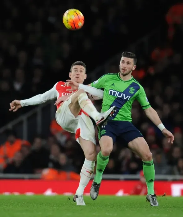 Framed Print : Intense Battle: Koscielny vs Long - Arsenal vs Southampton, Premier League 2015-16