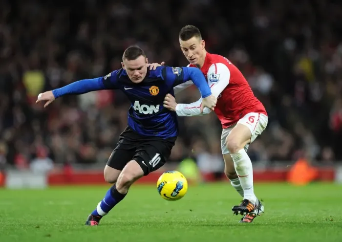 Framed Print : Intense Battle: Koscielny vs Rooney - Arsenal vs Manchester United (2011-12) Framed Print : Intense Battle: Koscielny vs Rooney - Arsenal vs Manchester United (2011-12)