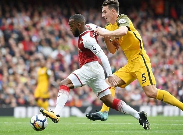 Intense Battle: Lacazette vs. Dunk in Arsenal's Premier League Clash