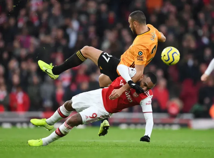 Framed Print : Intense Battle: Lacazette vs. Saiss - Arsenal vs. Wolverhampton Wanderers, Premier League 2019-20