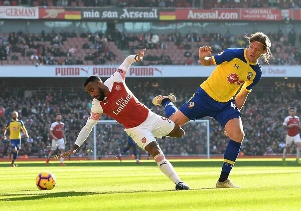 Intense Battle: Lacazette vs. Vestergaard in Arsenal vs. Southampton Showdown