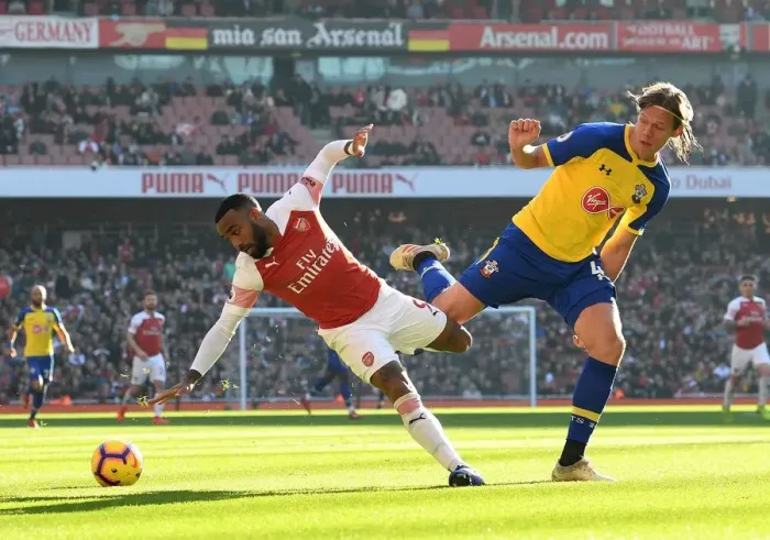 Framed Print : Intense Battle: Lacazette vs. Vestergaard in Arsenal vs. Southampton Showdown Framed Print : Intense Battle: Lacazette vs. Vestergaard in Arsenal vs. Southampton Showdown