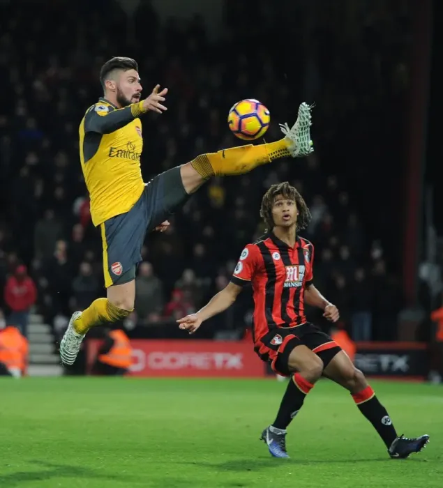Framed Print : Intense Battle: Olivier Giroud vs. Nathan Ake in the Premier League Clash between Arsenal and Bournemouth (2016-17) Framed Print : Intense Battle: Olivier Giroud vs. Nathan Ake in the Premier League Clash between Arsenal and Bournemouth (2016-17)