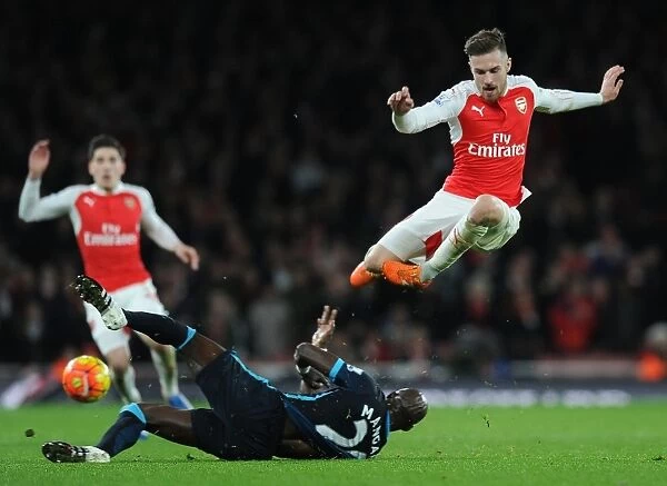 Intense Battle: Ramsey Tackles Mangala in Arsenal vs. Manchester City (2015-16)