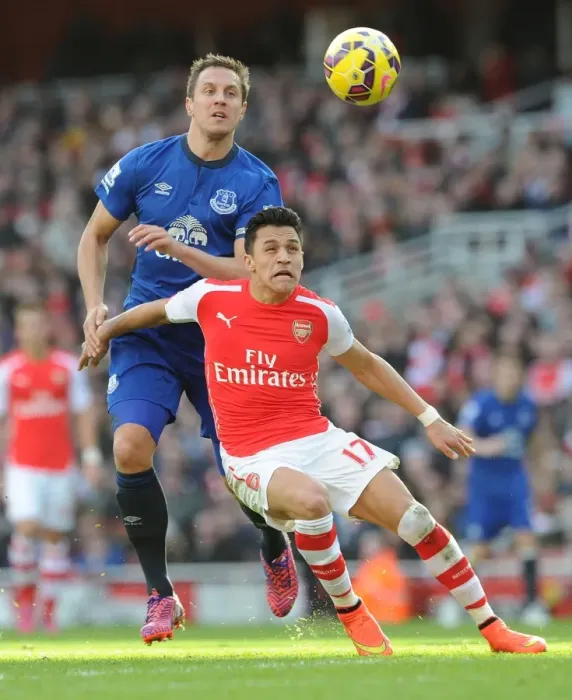 Framed Print : Intense Battle: Sanchez Holds Off Jagielka in Arsenal vs. Everton Clash Framed Print : Intense Battle: Sanchez Holds Off Jagielka in Arsenal vs. Everton Clash