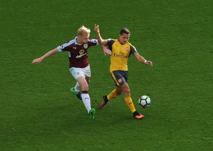 Framed Print : Intense Battle: Sanchez vs Mee - Premier League Showdown