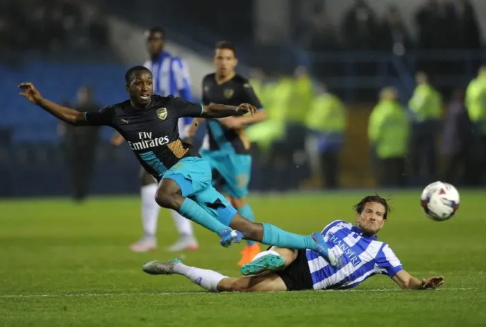 Framed Print : Intense Battle: Sheffield Wednesday vs. Arsenal in Capital One Cup Fourth Round