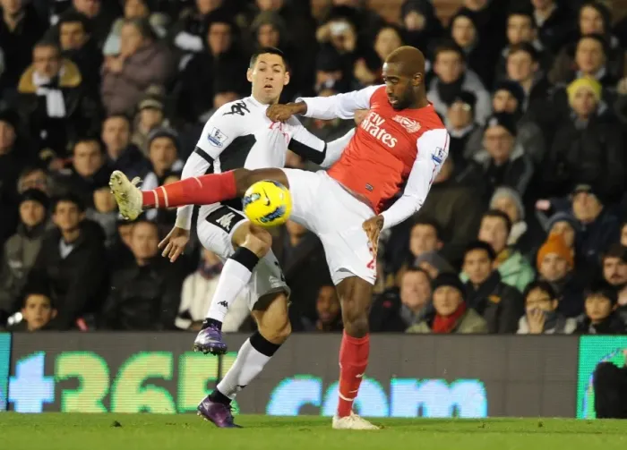 Framed Print : Intense Clash: Djourou vs. Dempsey, Arsenal vs. Fulham, Premier League, 2012