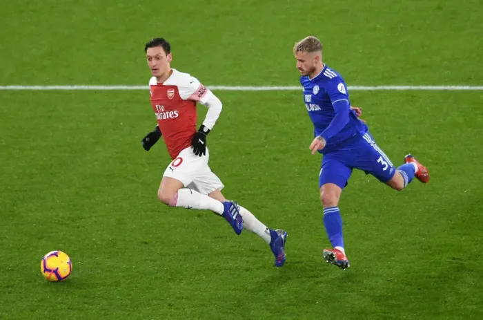 Framed Print : Intense Clash: Ozil vs. Bennett in Arsenal's Battle Against Cardiff Framed Print : Intense Clash: Ozil vs. Bennett in Arsenal's Battle Against Cardiff
