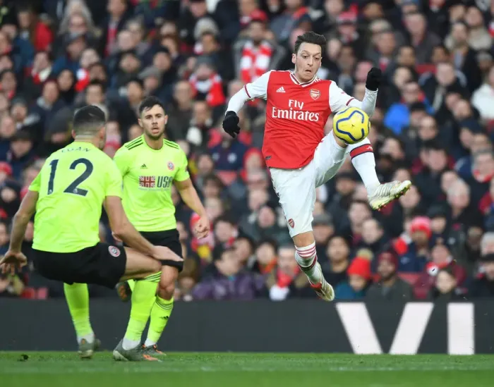 Framed Print : Intense Clash: Ozil vs. Egan in the Premier League - Arsenal vs. Sheffield United