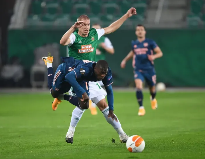 Framed Print : Intense Clash: Partey Fouls and Dramatic Moments - Rapid Vienna vs. Arsenal FC, Europa League