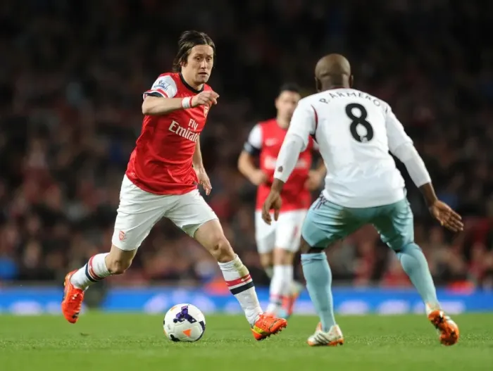 Framed Print : Intense Clash: Rosicky vs. Armero - Premier League Battle at Emirates Stadium