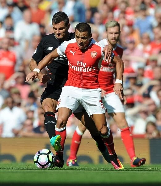 Intense Clash: Sanchez Fouls Lovren in Arsenal vs. Liverpool (2016-17)
