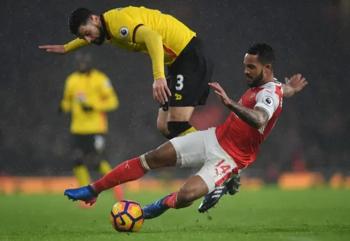 Framed Print : Intense Clash: Theo Walcott vs. Miguel Britos in Arsenal's Battle against Watford (Premier League 2016-17) Framed Print : Intense Clash: Theo Walcott vs. Miguel Britos in Arsenal's Battle against Watford (Premier League 2016-17)