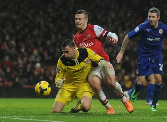 Framed Print : Intense Clash: Wilshere vs. Marshall - Arsenal's Premier League Battle Framed Print : Intense Clash: Wilshere vs. Marshall - Arsenal's Premier League Battle