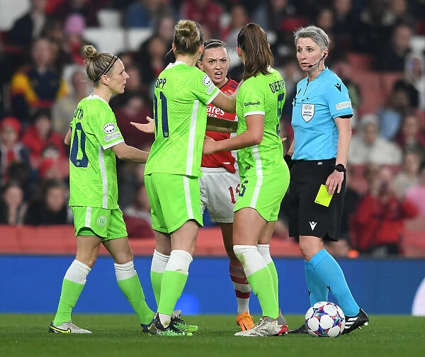 Intense Discussion Between McCabe and Popp: Arsenal Women vs. VfL Wolfsburg in UEFA Women's Champions League Quarterfinal