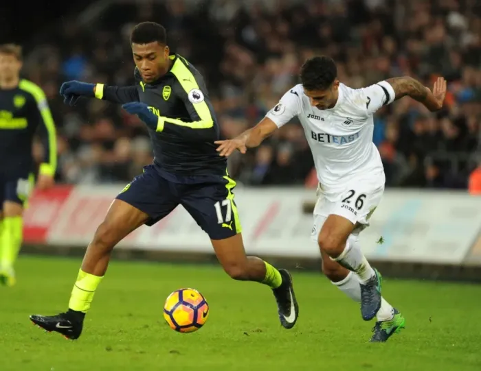 Framed Print : Intense Face-Off: Alex Iwobi vs Kyle Naughton - Swansea vs Arsenal Premier League Clash