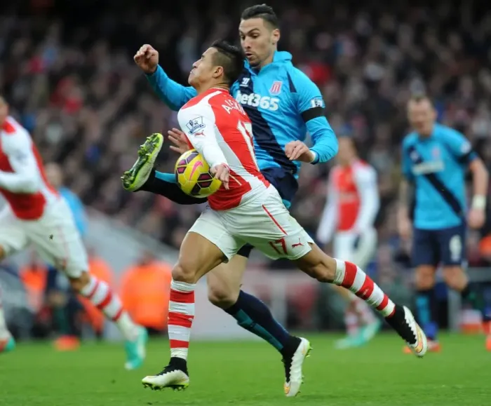 Framed Print : Intense Face-Off: Alexis Sanchez vs. Geoff Cameron - Arsenal's Premier League Battle