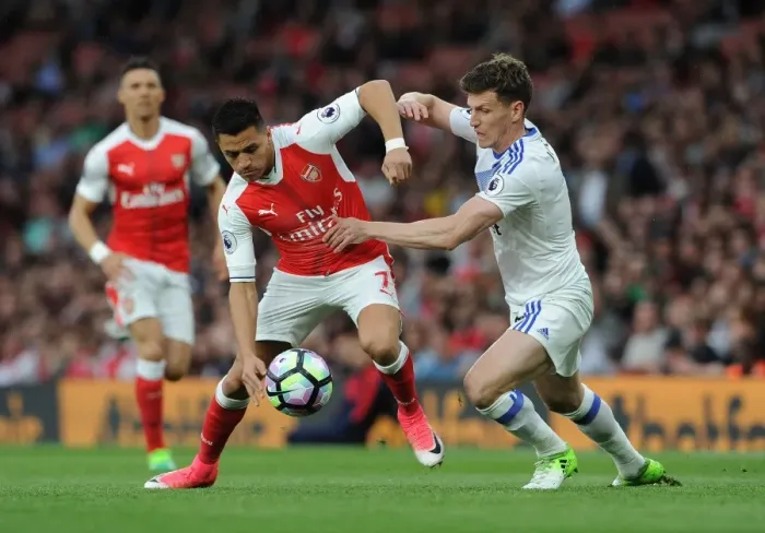 Framed Print : Intense Face-Off: Alexis Sanchez vs. Billy Jones in Premier League Showdown