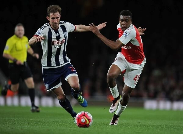 Intense Face-Off: Iwobi vs. McAuley in Arsenal's Battle Against West Brom