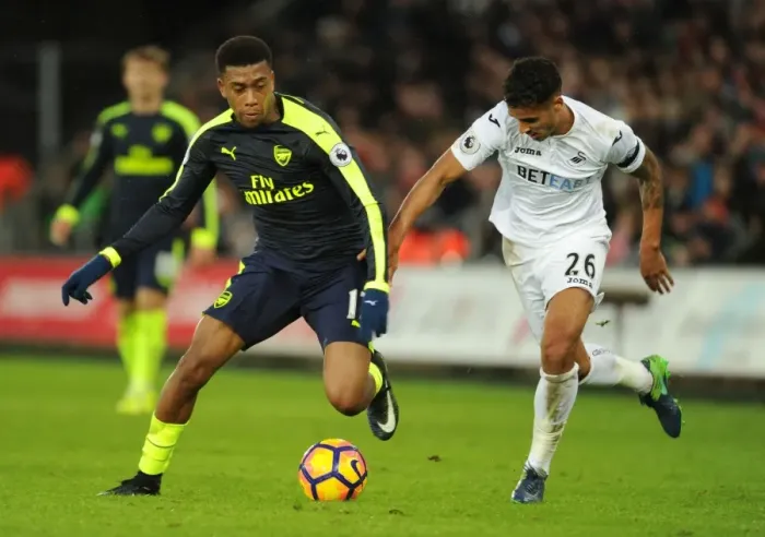 Framed Print : Intense Face-Off: Iwobi vs Naughton in Swansea-Arsenal Premier League Clash Framed Print : Intense Face-Off: Iwobi vs Naughton in Swansea-Arsenal Premier League Clash