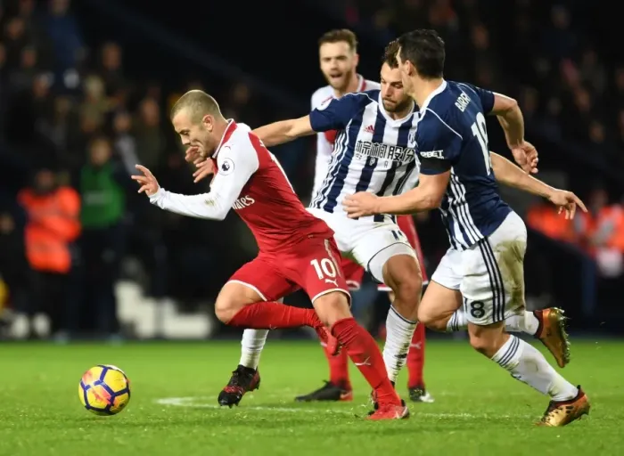 Framed Print : Intense Face-Off: Jack Wilshere vs. Jay Rodriguez and Gareth Barry in Arsenal vs. West Bromwich Albion Premier League Clash Framed Print : Intense Face-Off: Jack Wilshere vs. Jay Rodriguez and Gareth Barry in Arsenal vs. West Bromwich Albion Premier League Clash