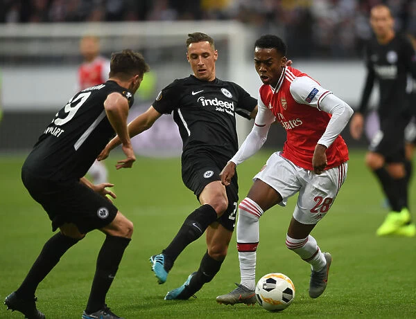 Intense Face-Off: Joe Willock vs. Dominik Kohr in Europa League Battle between Eintracht Frankfurt and Arsenal