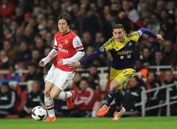 Intense Face-Off: Rosicky vs. Rangel in Arsenal's Premier League Battle