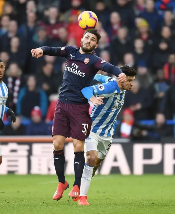 Framed Print : Intense Face-Off: Sead Kolasinac vs. Christopher Schindler - Huddersfield Town vs. Arsenal FC Premier League Clash Framed Print : Intense Face-Off: Sead Kolasinac vs. Christopher Schindler - Huddersfield Town vs. Arsenal FC Premier League Clash