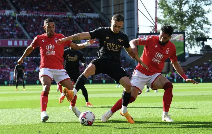 Framed Print : Intense Face-Off: Trossard vs. Lodi & Felipe - Nottingham Forest vs. Arsenal Premier League Clash Framed Print : Intense Face-Off: Trossard vs. Lodi & Felipe - Nottingham Forest vs. Arsenal Premier League Clash