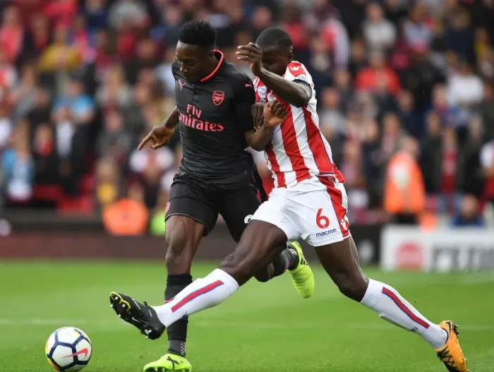 Framed Print : Intense Face-Off: Welbeck vs Zouma, Premier League 2017-18 - Arsenal's Welbeck Goes Head to Head with Stoke's Zouma