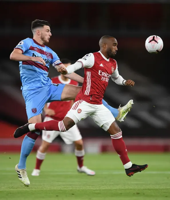 Framed Print : Intense Heading Showdown: Lacazette vs. Rice in Arsenal's Battle with West Ham Framed Print : Intense Heading Showdown: Lacazette vs. Rice in Arsenal's Battle with West Ham