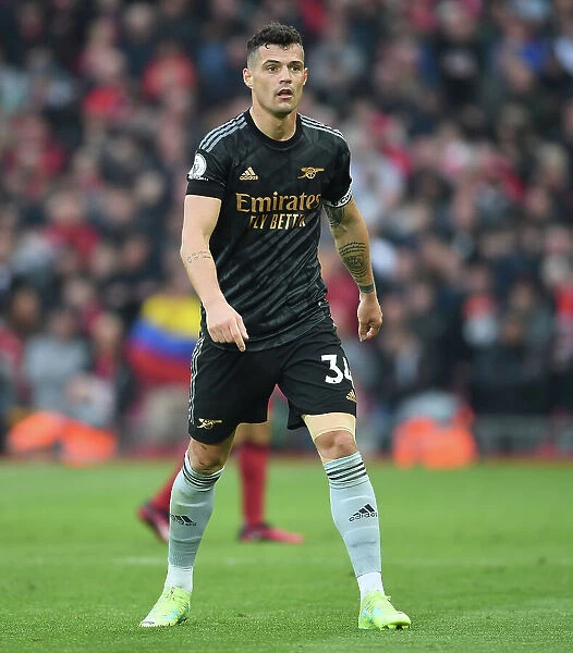 Intense Midfield Battle: Granit Xhaka Fights It Out Against Liverpool in the Premier League 2022-23