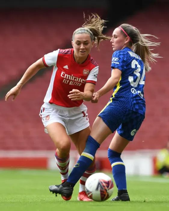 Framed Print : Intense Pre-Season Clash: Arsenal Women vs. Chelsea Women - McCabe Fouls Wardlaw at Emirates Stadium