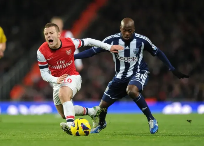 Framed Print : Intense Premier League Clash: Jack Wilshere Fouls Youssouf Mulumbu (Arsenal vs. West Bromwich Albion, 2012-13)