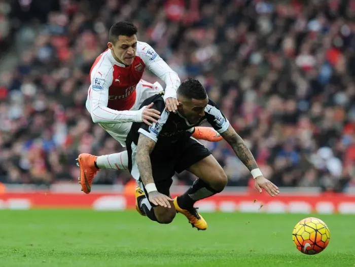 Framed Print : Intense Premier League Clash: Sanchez Fouls Simpson (Arsenal vs Leicester City, 2015-16) Framed Print : Intense Premier League Clash: Sanchez Fouls Simpson (Arsenal vs Leicester City, 2015-16)