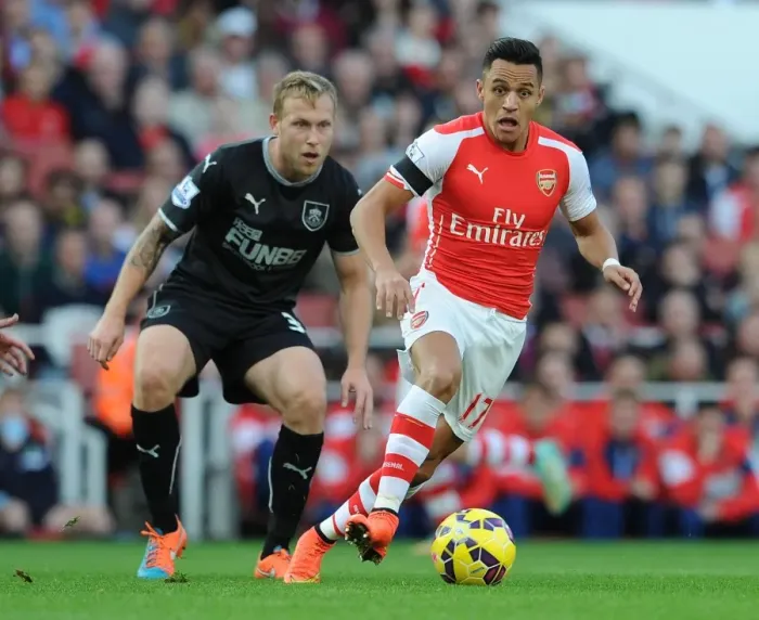 Framed Print : Intense Rivalry: Alexis Sanchez vs. Scott Arfield - Arsenal's Battle Against Burnley Framed Print : Intense Rivalry: Alexis Sanchez vs. Scott Arfield - Arsenal's Battle Against Burnley
