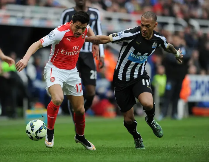 Framed Print : Intense Rivalry: Alexis Sanchez vs. Yoan Gouffran - Arsenal's Battle in Newcastle Framed Print : Intense Rivalry: Alexis Sanchez vs. Yoan Gouffran - Arsenal's Battle in Newcastle