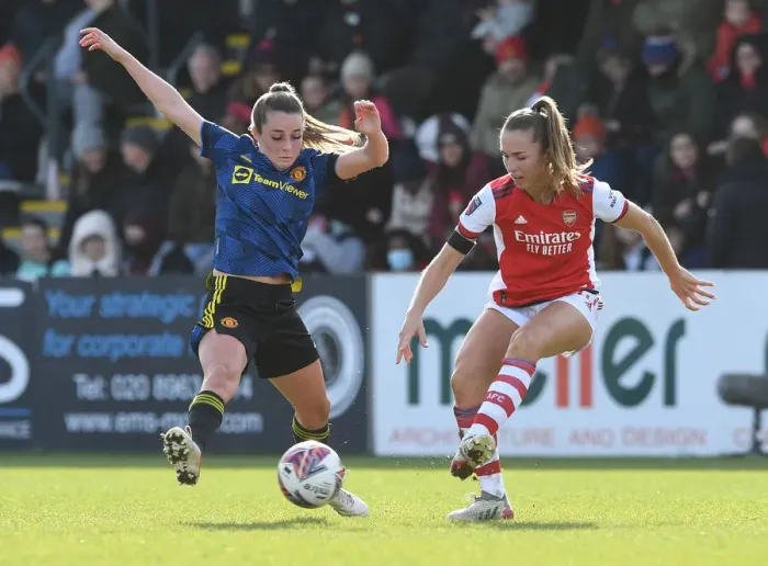Framed Print : Intense Rivalry: Arsenal Women vs Manchester United Women in FA WSL Clash