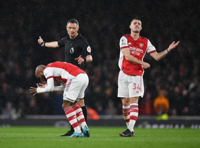 Framed Print : Intense Rivalry: Arsenal's Lacazette and Xhaka's Reaction to Referee Decision Amidst Arsenal vs. Liverpool Controversy (2021-22)