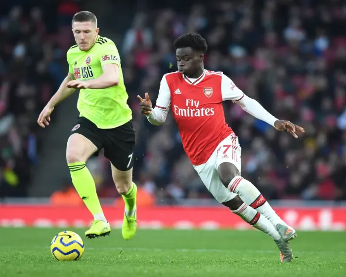Framed Print : Intense Rivalry: Bukayo Saka vs. John Lundstram - Arsenal's Battle Against Sheffield United Framed Print : Intense Rivalry: Bukayo Saka vs. John Lundstram - Arsenal's Battle Against Sheffield United