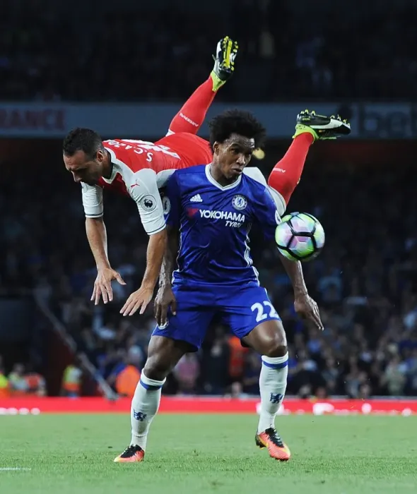Framed Print : Intense Rivalry: Cazorla Soars Past Willian in Arsenal vs. Chelsea Clash (2016-17)