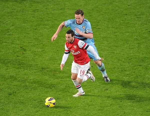 Intense Rivalry: Cazorla vs. Nolan Clash in Arsenal vs. West Ham Premier League Showdown