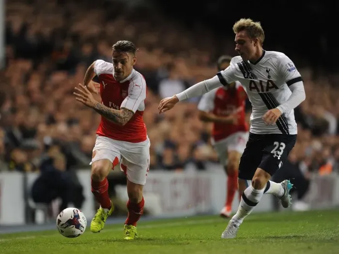 Framed Print : Intense Rivalry: Debuchy vs. Eriksen in the Battle of the Capital One Cup: Tottenham vs. Arsenal