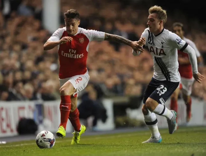 Framed Print : Intense Rivalry: Debuchy vs. Eriksen in the Capital One Cup Showdown between Arsenal and Tottenham