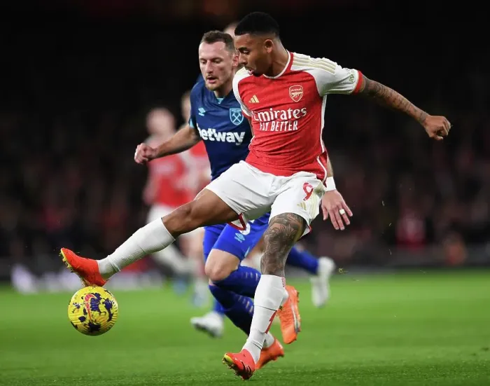 Framed Print : Intense Rivalry: Gabriel Jesus Stands Firm Against Coufal in Arsenal's Battle with West Ham (2023-24)