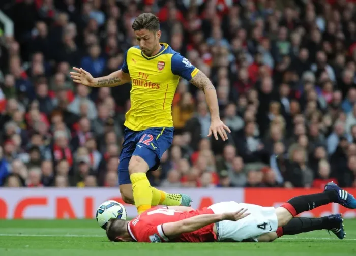 Framed Print : Intense Rivalry: Giroud vs Jones at Old Trafford - Manchester United vs Arsenal, Premier League 2014-15