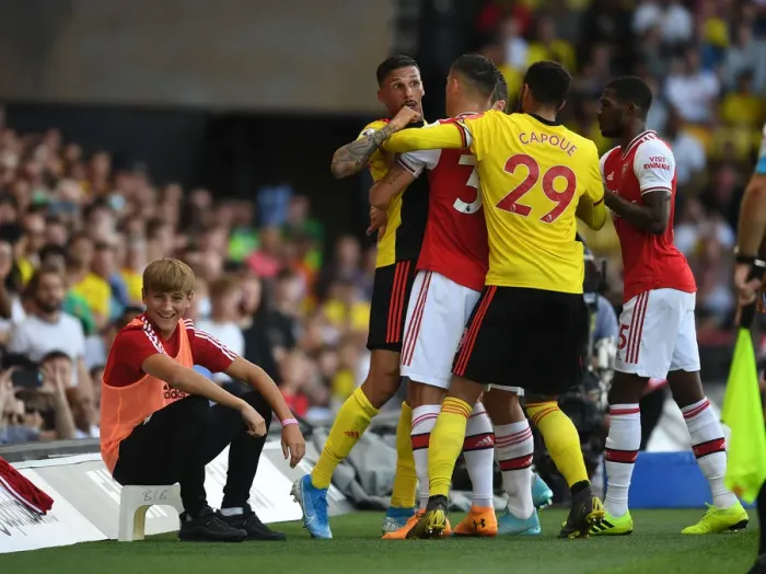 Framed Print : Intense Rivalry: Holebas, Capoue, and Xhaka Clash Heats Up in Watford vs Arsenal Match